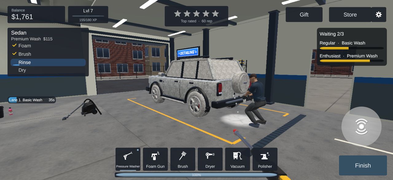A worker foams an SUV in the side bay.
